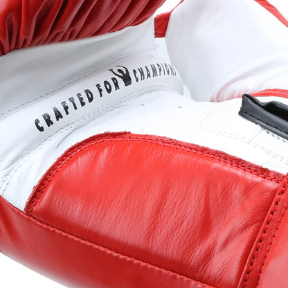 Xpeed XP101 contest boxing gloves in black with red accents, showing padding and secure wrist straps for professional training and competition.