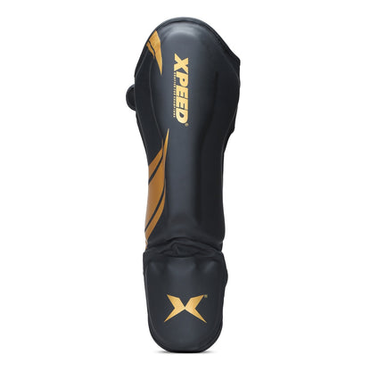 Xpeed XP1806 golden MMA shin pad made of premium PU material, designed for martial arts and combat sports protection.