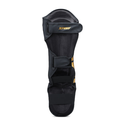Xpeed XP1806 Golden MMA shin pad with premium PU material, designed for martial arts and kickboxing protection.