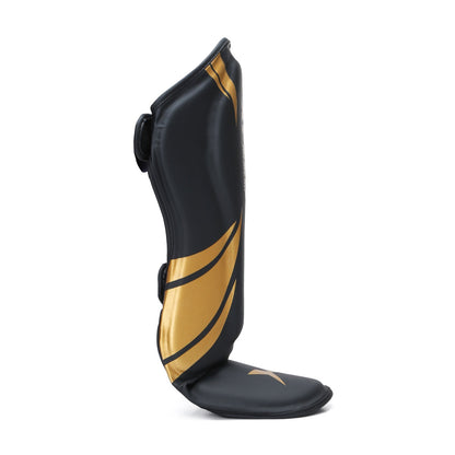 Xpeed XP1806 gold MMA and martial arts shin pad with premium PU material, designed for protection during combat sports.