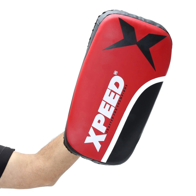 Xpeed XP2489 Fighter Thai pad for professional kickboxing and MMA striking training, showing the padded striking surface.