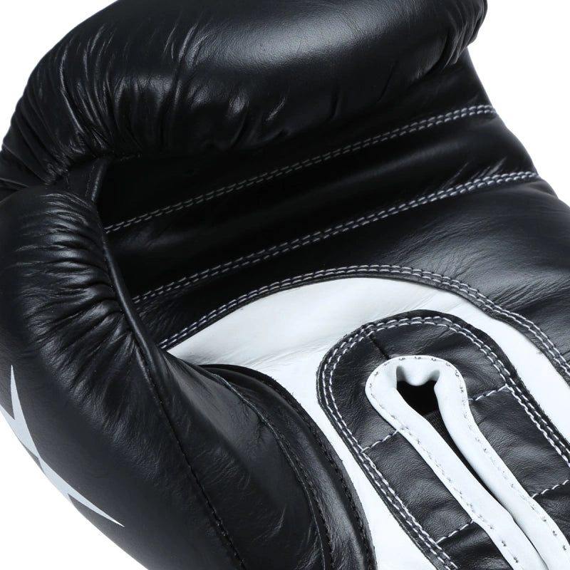 Xpeed XP2805 Elite professional boxing gloves in black with padded thumb and secure wrist strap for enhanced performance.