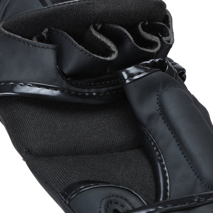 Black Xpeed XP3055 MMA glove made of matte PU with striking design, suitable for martial arts training and competitions.
