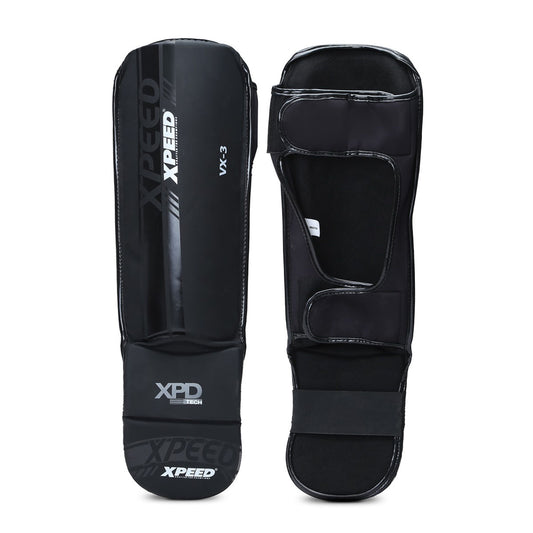 Black Xpeed XP3058 matte PU grappling shinguard showing padded protection and adjustable straps for martial arts training.
