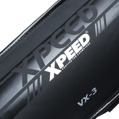 Black Xpeed XP3058 Matt PU grappling shinguard showing padded shin protection and adjustable straps for combat sports.