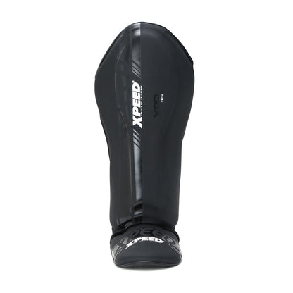 Black matte Xpeed XP3059 stand-up shinguard showing padded front and adjustable straps for secure fit.