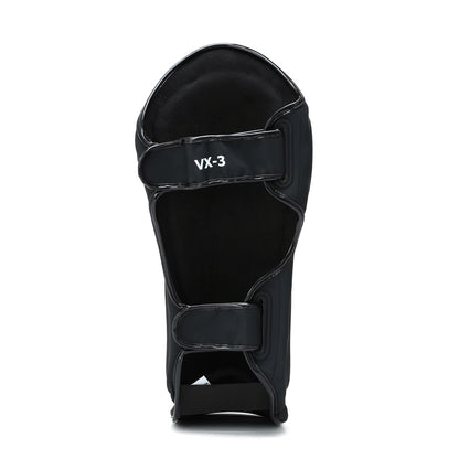 Black Xpeed XP3059 Matt PU stand-up shinguard with padded protection and adjustable straps for secure fit.
