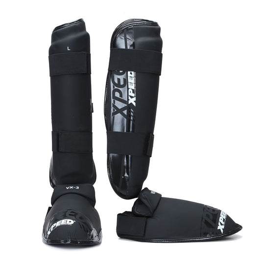Black matte Xpeed XP3060 shinpad with attached foot protector, designed for sports or protective use.