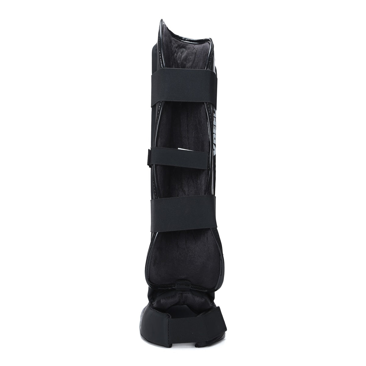 Black Xpeed XP3060 Xpeed Matt PU shinpad with foot strap, designed for protective sports gear.