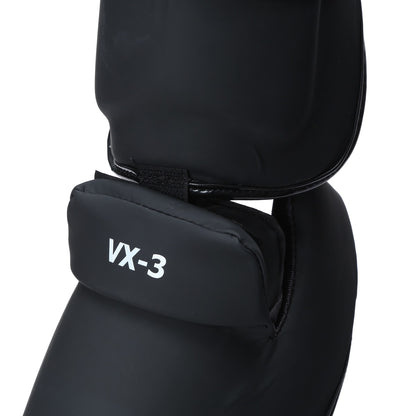 Xpeed XP3060 matte black PU shinpad with foot strap, designed for protective sports gear, featuring a sleek matte finish.