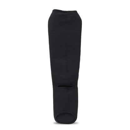 XPEED XP3066 fabric shin guards for martial arts and MMA, showing black compression guards with padding and adjustable straps.