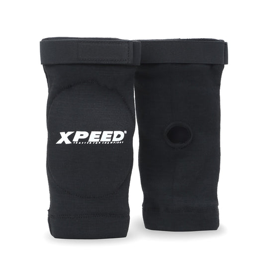 XPEED XP3067 fabric elbow guard with high-density foam support, ideal for gym and MMA training, shown on a model's elbow.
