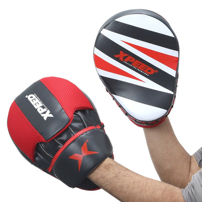 XPEED XP404 curved focus pads with multi-layer foam for boxing and MMA training, showing the padded target surface and grip handles.
